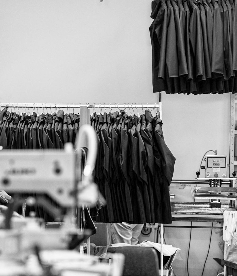 Garments on racks on the Vinayak Garments production floor